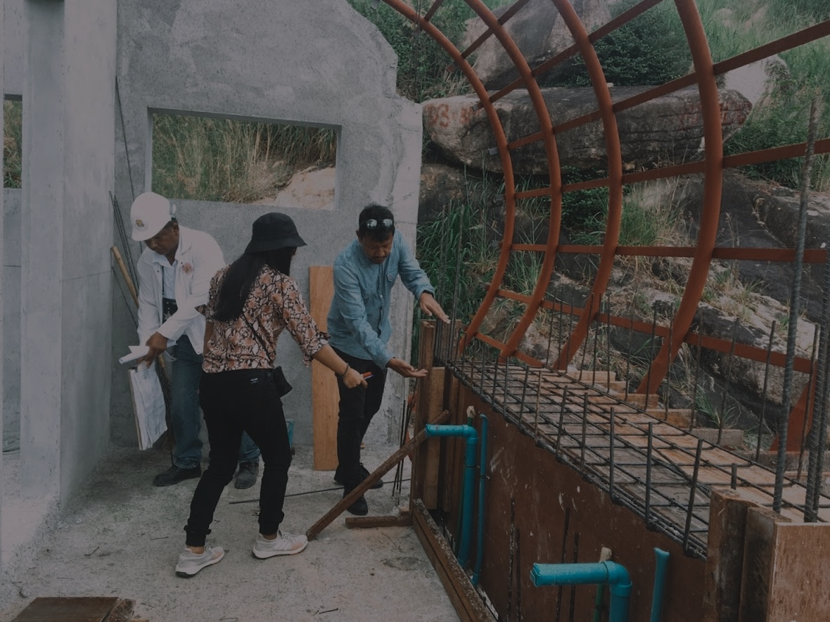 Architect Nay inspects a construction site in Koh Samui